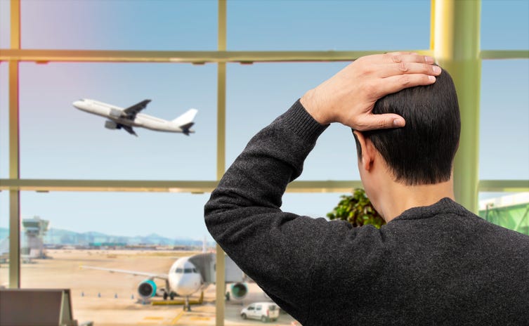 Sad Man Looking At Missed Flight