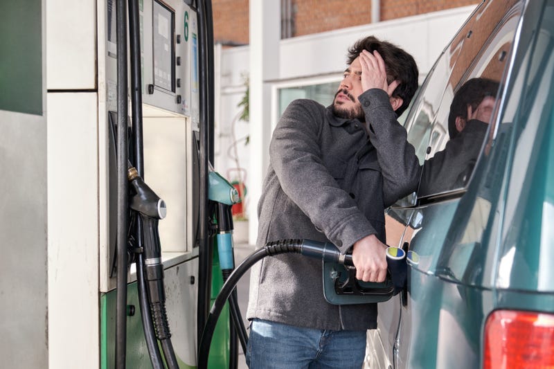 Man worried about gas prices rising.