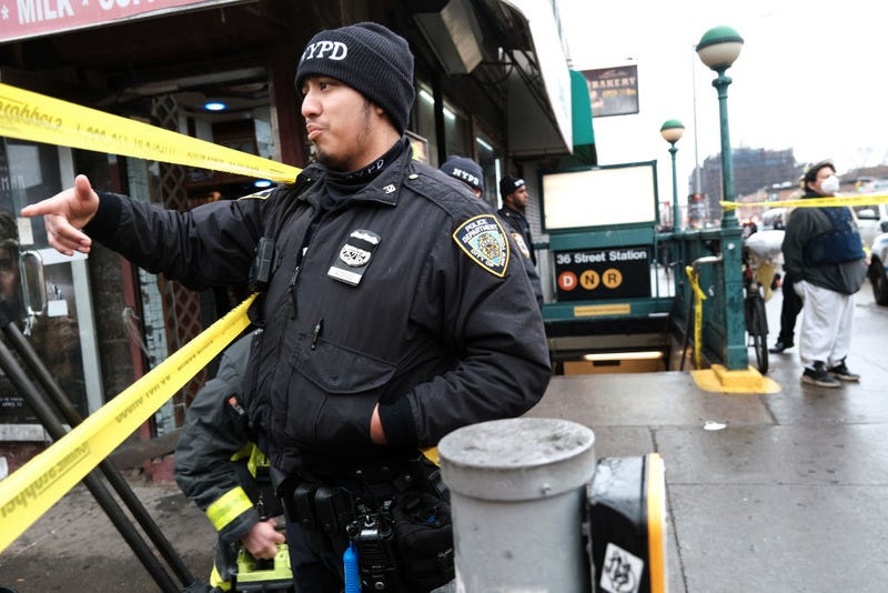 Police and emergency responders gather at the site of a reported shooting of multiple people outside of the 36 St subway station on April 12, 2022 in the Brooklyn borough of New York City
