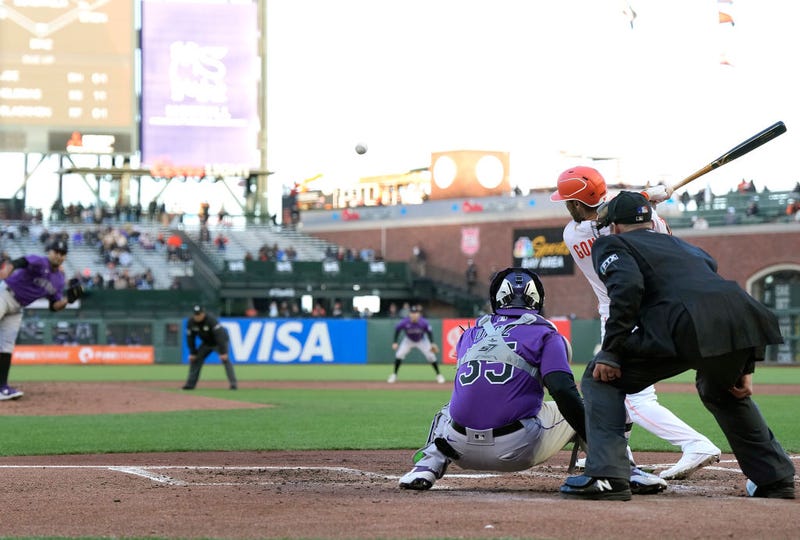 Luis Gonzalez of the San Francisco Giants hits an RBI infield single against the Colorado Rockies in the bottom of the second inning at Oracle Park on May 10, 2022 in San Francisco, California.
