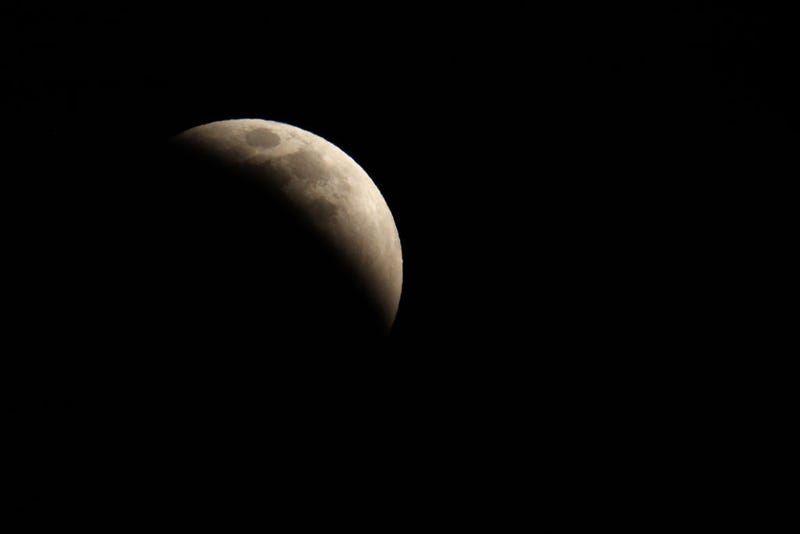 A total lunar eclipse creates a "super blood moon" on May 15, 2022 in Huntington Beach, California.