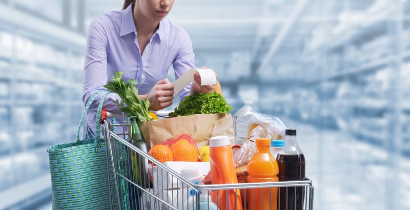 Woman Checking Grocerey Receipt