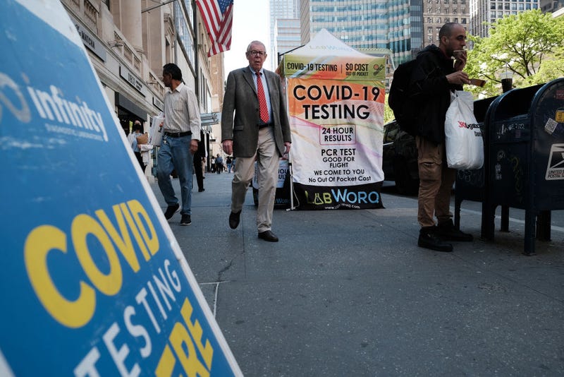 People walk past a Covid testing site on May 17, 2022 in New York City.