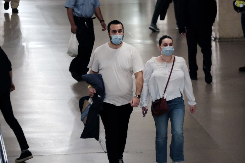 People wear masks inside a store on May 17, 2022 in New York City. New York’s health commissioner, Dr. Ashwin Vasan, has moved from a "medium" COVID-19 alert level to a "high" alert level in all the five boroughs following a surge in cases. (Photo by Spencer Platt/Getty Images)