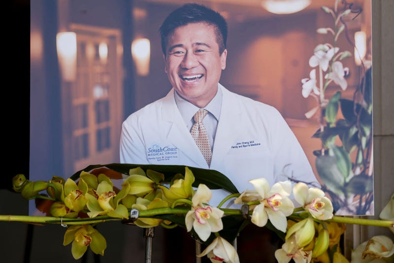 A makeshift memorial for Dr. John Cheng is seen outside his office on May 18, 2022 in Aliso Viejo, California.