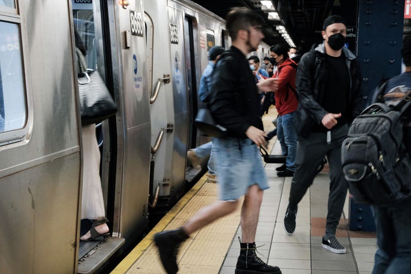 : People walk through a Manhattan subway station on May 24, 2022 in New York City.