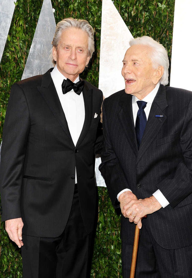 Actors Michael Douglas (L) and Kirk Douglas arrive at the 2012 Vanity Fair Oscar Party hosted by Graydon Carter at Sunset Tower on February 26, 2012 in West Hollywood, California