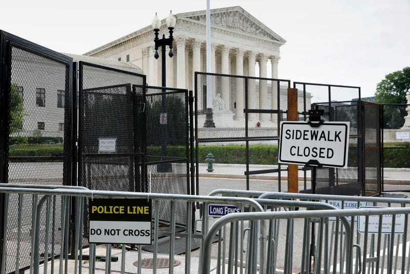 The U.S. Supreme Court building continues to be surrounded by a temporary security fence on June 22, 2022 in Washington, DC. The Court is due to hand down opinions in several important cases, including Dobbs v. Jackson Women’s Health Organization, which could overturn the 50-year-old federal right to abortion.