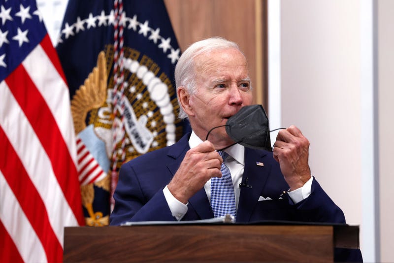 U.S. President Joe Biden takes his face mask off during a meeting on the U.S. Economy with CEOs and members of his Cabinet in the South Court Auditorium of the White House on July 28, 2022 in Washington, DC.