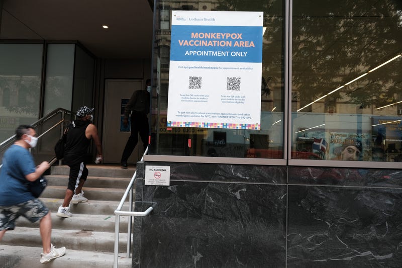 People walk by a health care facility that is administering the monkeypox vaccine by appointment on Aug. 5, 2022 in New York City