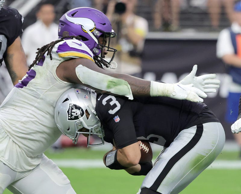 : Defensive tackle Armon Watts #96 of the Minnesota Vikings sacks quarterback Jarrett Stidham #3 of the Las Vegas Raiders during their preseason game at Allegiant Stadium on August 14, 2022