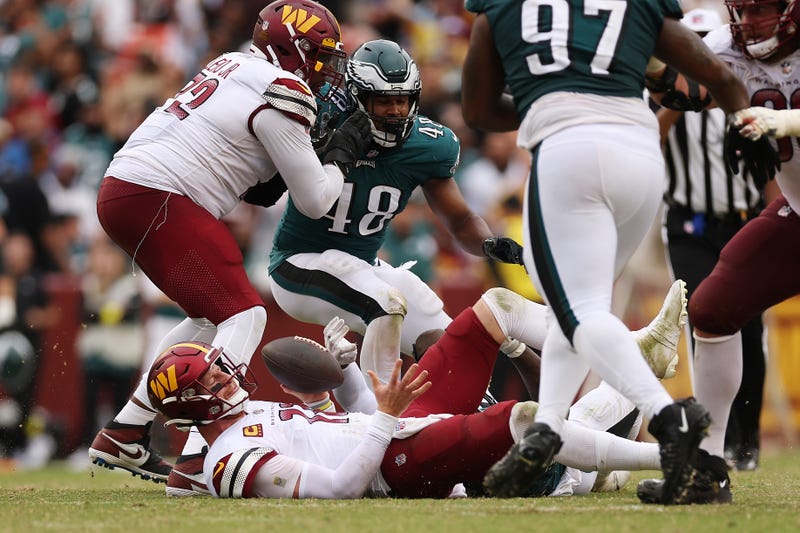 Carson Wentz is sacked during the Commanders' loss to the Eagles in Week 3 of the 2022-23 NFL season.