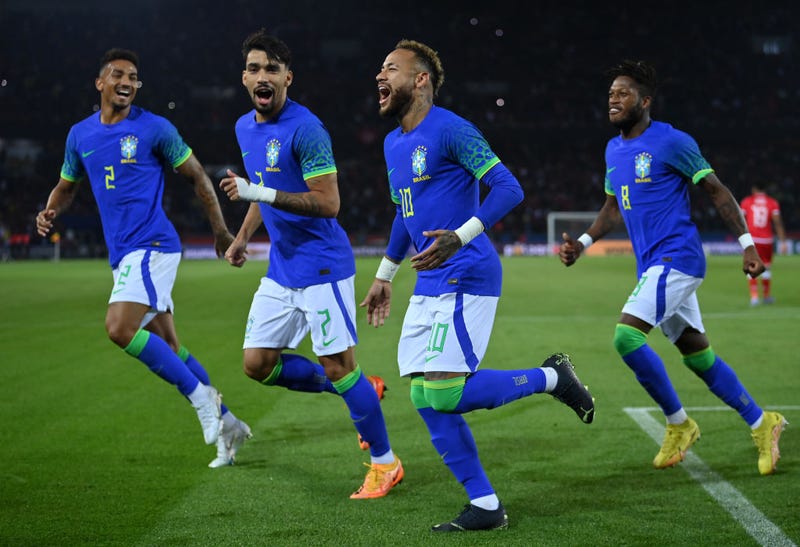Neymar of Brazil celebrates after scoring their sides third goal with Fred, Lucas Paqueta and Danilo of Brazil during the International Friendly match between Brazil and Tunisia at Parc des Princes on September 27, 2022 in Paris, France.