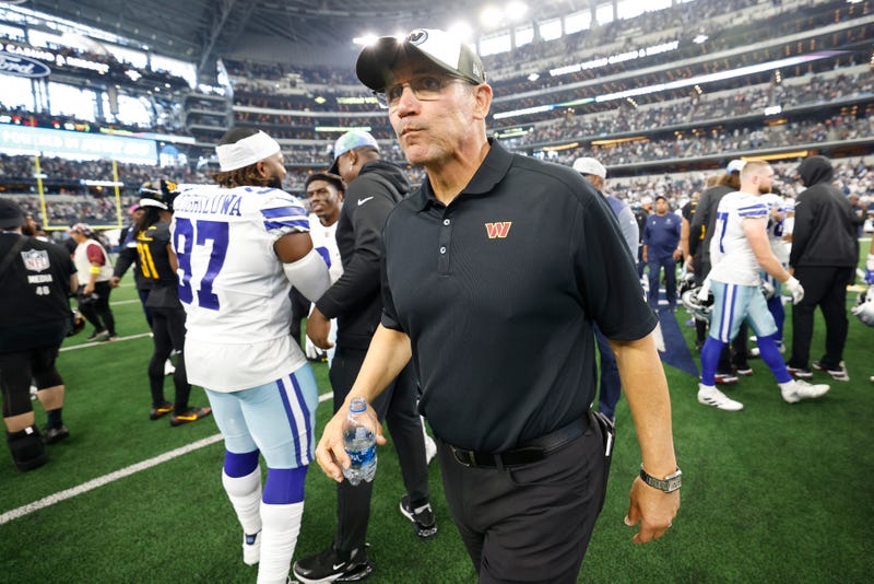 Washington Commanders coach Ron Rivera walks onto the field after the team's 25-10 loss to the Dallas Cowboys in 2022.