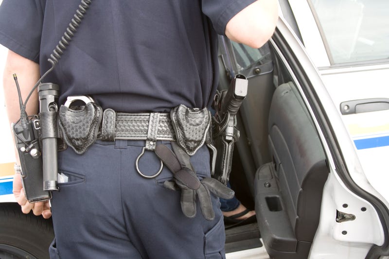 Police officer speaks to suspect in car