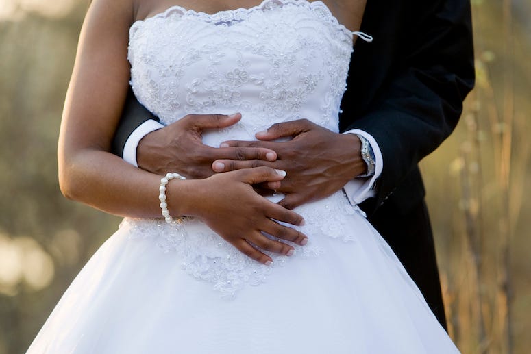 Groom holding bride