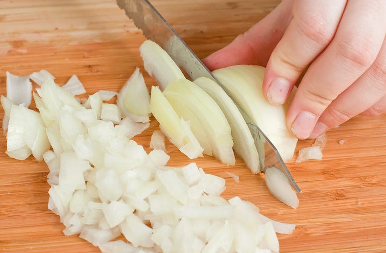 Chopping onions on a wooden block