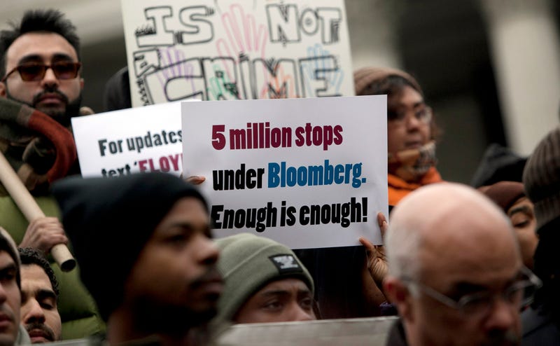 A man holds a sign during a demonstration against the city's "stop and frisk" searches in lower Manhattan near Federal Court March 18, 2013 in New York City. Hearings in a federal lawsuit filed by four black men against the city police department's "stop and frisk" searches starts today in Manhattan Federal Court.