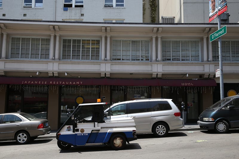 A San Francisco Municipal Transportation Agency parking control officer patrols on July 3, 2013 in San Francisco, California.