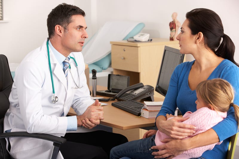 doctor talking to mother