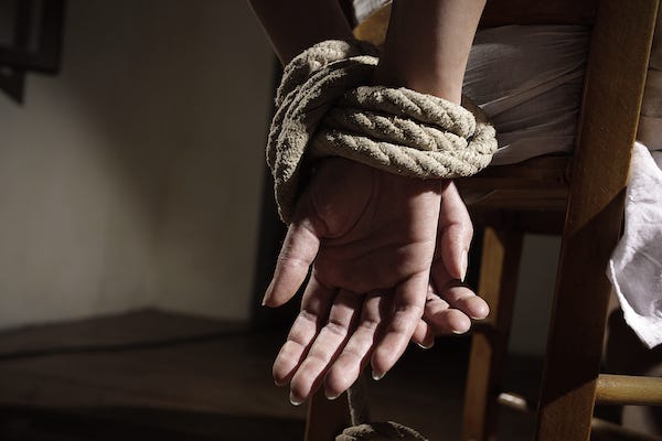 Woman tied to chair