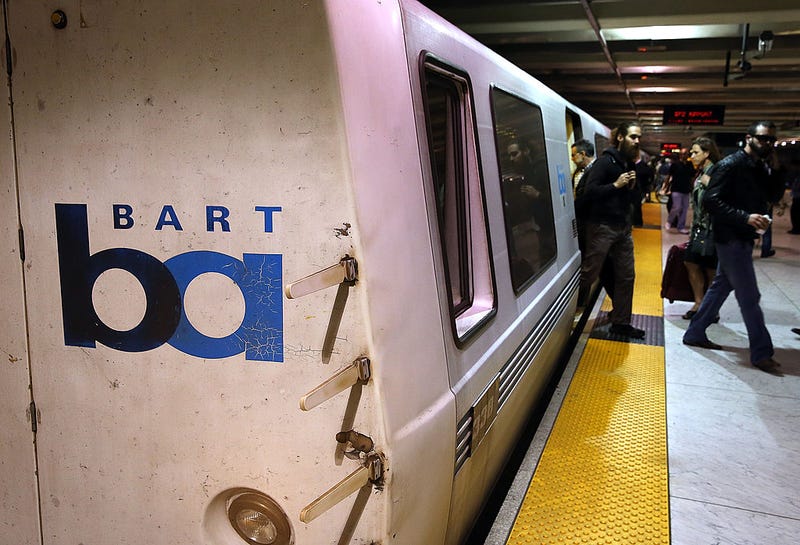 Bay Area Rapid Transit (BART) passengers walk off of a train on October 15, 2013 in San Francisco, California