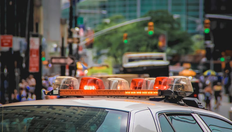 Police cop car in the middle of a city 