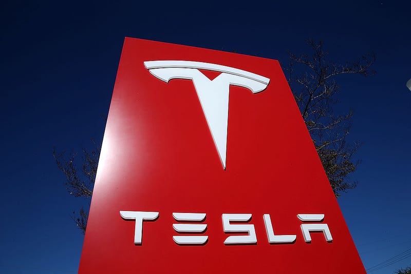 A sign is posted at a Tesla showroom on November 5, 2013 in Palo Alto, California. Tesla will report third quarter earnings today after the closing bell.