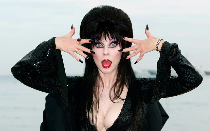 Actress Cassandra Peterson "Elvira" poses during a photo call for the film "Elvira's Haunted Hills" at the Rado Beach