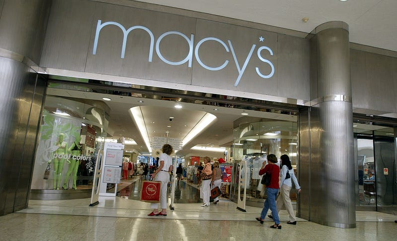 Customers walk out of Macy's the day after the company announced that the 56 Burdines stores and the seven Macy's stores in Florida all will operate under the combined name of Burdines-Macy's May 23, 2003 in North Miami, Florida.
