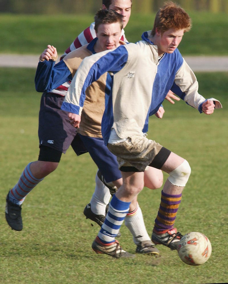 prince harry plays soccer during his last year of attendance at eton college