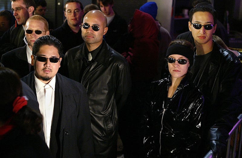 Fans dressed as characters from the movie line up for the opening of the film Matrix Revolution at Graumann's Chinese Theater November 5, 2003 in Hollywood, California.