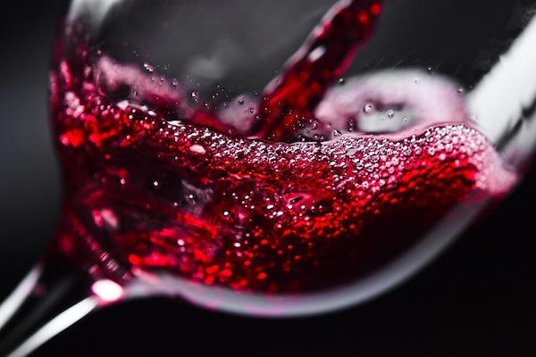 Red wine being poured into a glass
