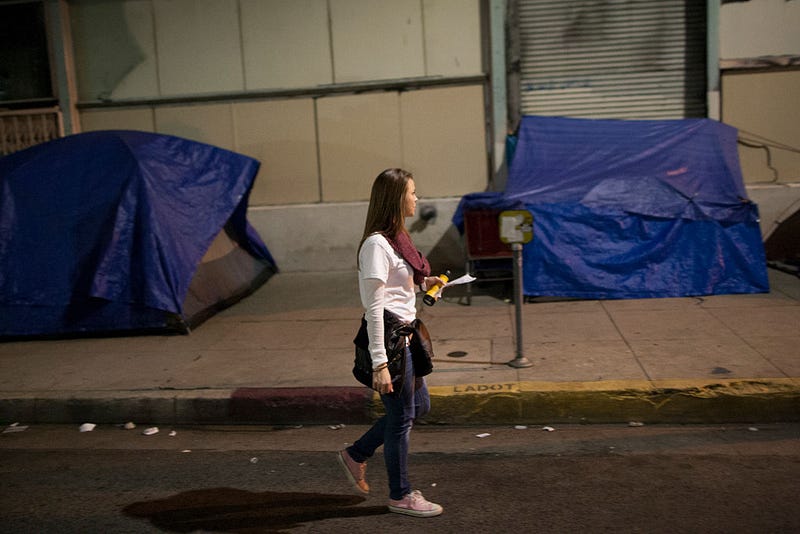 Volunteers count homeless people on Skid Row during the 2015 Greater Los Angeles Homeless Count conducted by the Los Angeles Homeless Services Authority (LAHSA) on January 29, 2015 in Los Angeles, California. About 6,000 volunteers take part in counting the homeless people that they see as well as tents, cars and other structures used by the homeless, but avoid estimating the amount of people that might be inside such shelters. The last Greater Los Angeles Homeless Count, which took place in 2013, found that LA had one of the largest homeless populations in the country, with more than 39,000 men, women and children living on the streets. (Photo by David McNew/Getty Images)