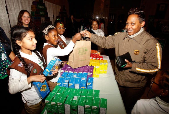 Girl Scouts selling cookies