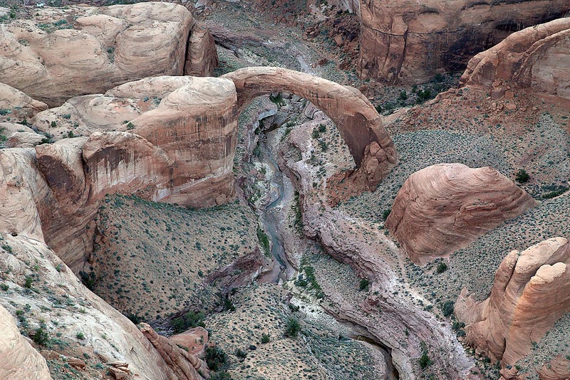 Water trickles under the Rainbow Bridge at Lake Powell on March 28, 2015 in Lake Powell, Utah.