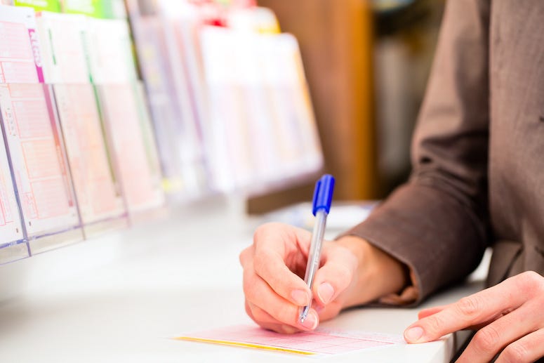 Woman filling out lottery ticket