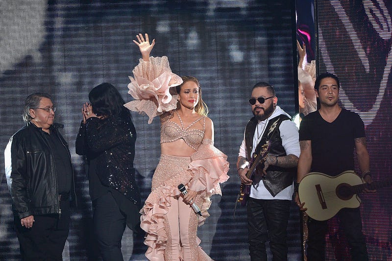 Jennifer Lopez and Los Dinos onstage after performing musical tribute to Selena at the 2015 Billboard Latin Music Awards presented bu State Farm on Telemundo at Bank United Center on April 30, 2015 in Miami, Florida.