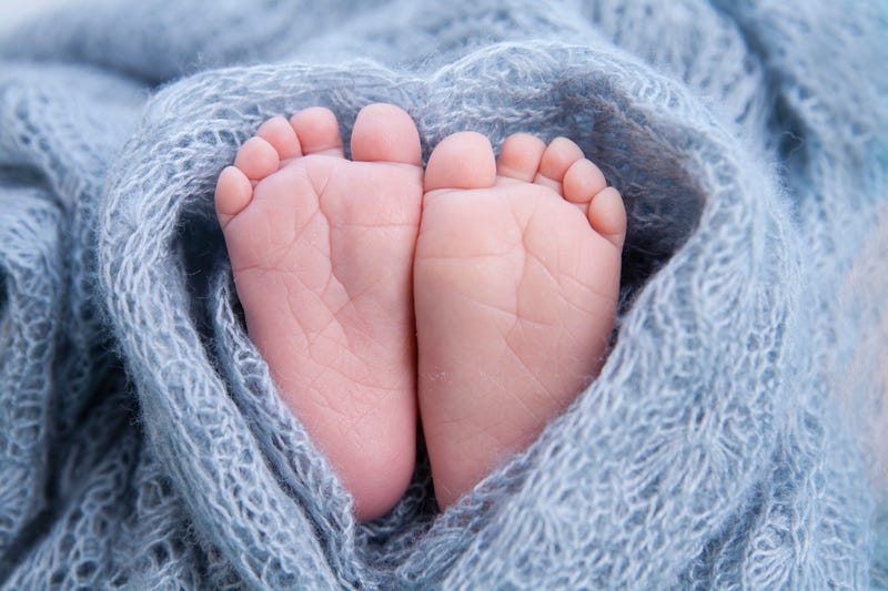 baby feet in a blue blanket