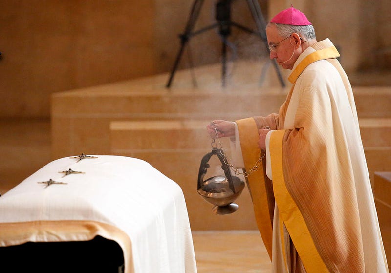 Archbishop Jose Gomez blesses the casket of LAPD officer Nicholas Lee as hundreds of fellow officers gathered at the Cathedral of Our Lady of the Angels on March 13, 2014 in Los Angeles, California.