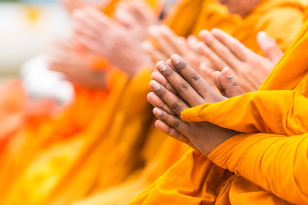 Buddhist monks praying
