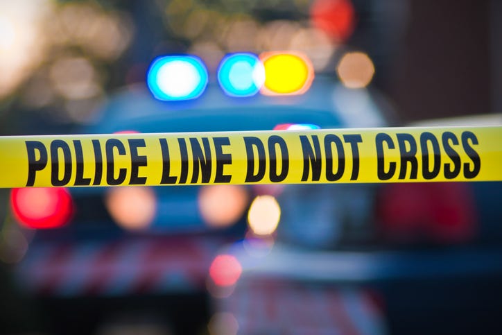 accident scene with a police line do not cross
