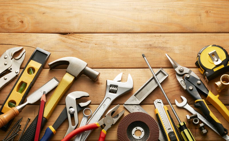 Table top with tools spread across.