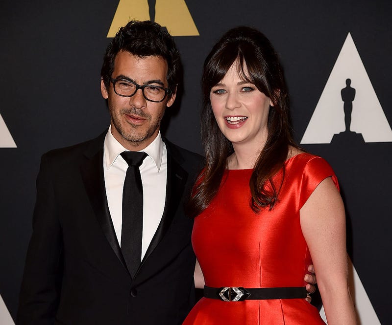 Zooey Deschanel and Jacob Pechenik attend a red carpet event.