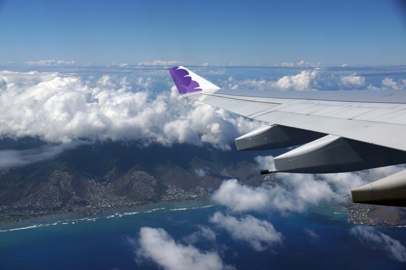 Two Hawaiian Airlines flights returned to Honolulu airport due to unruly passengers.