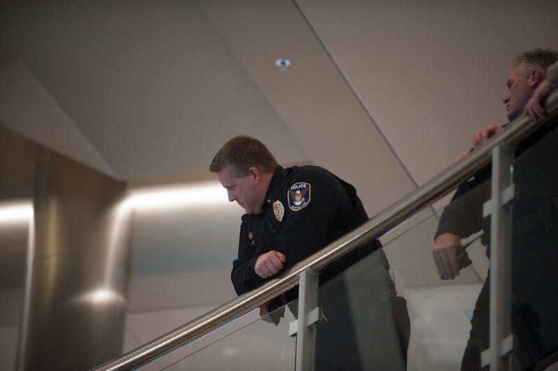 BLOOMINGTON, MN - DECEMBER 23: A police officer looks down into the rotunda of the Mall of America in Bloomington, MN, observing the planned Black Lives Matter demonstration on December 23, 2015 in Bloomington, Minnesota. Black Lives Matter Minneapolis staged a brief protest at the Mall of America in Bloomington, MN before moving their protest to the airport.