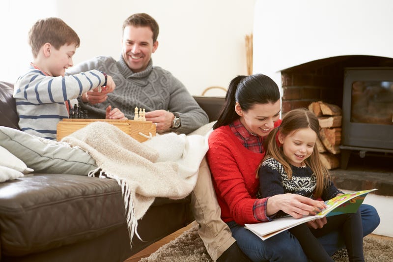 Adults and kids play games and read together