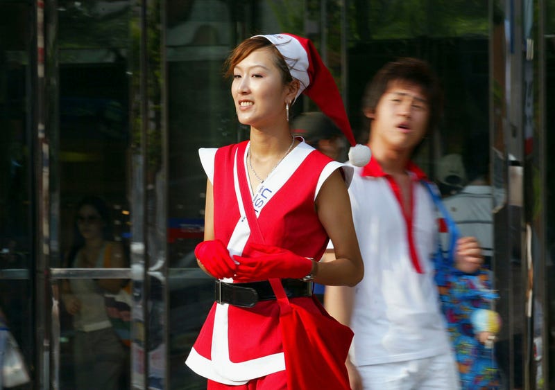 woman wearing summery santa suit