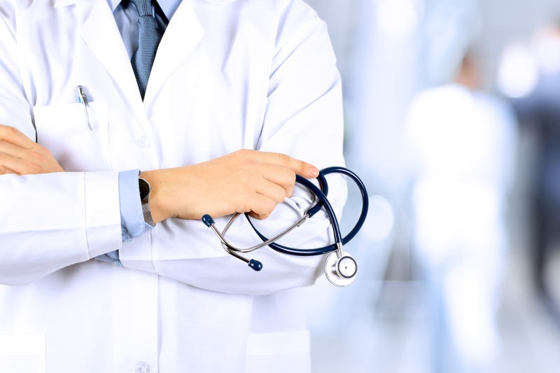male doctor holding a stethoscope