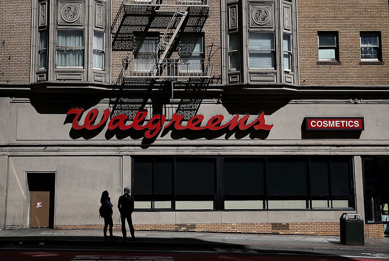 Pedestrians walk by a Walgreens store on April 5, 2016 in San Francisco, California.